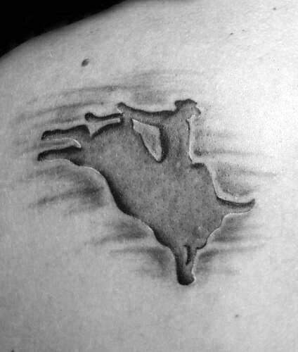 Minimalist bull rider tattoo with a carved-out effect, featuring a silhouette of a cowboy on a bucking bull with subtle shading for depth.