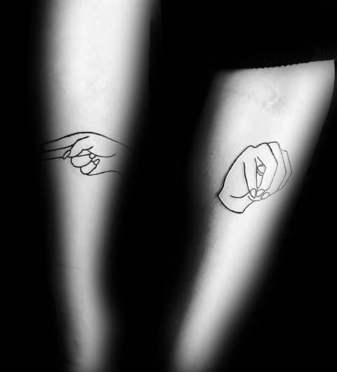 minimalist black line tattoo of hands signing in American Sign Language, placed on both forearms with a simple and elegant design