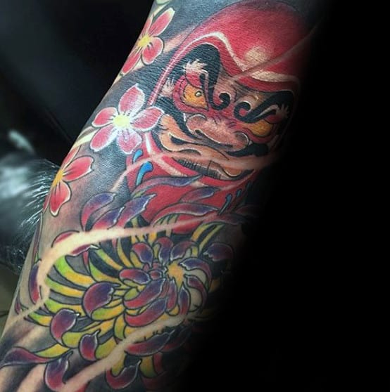 Creative Sleeve Tattoo Of Daruma Doll Floral Design For Men