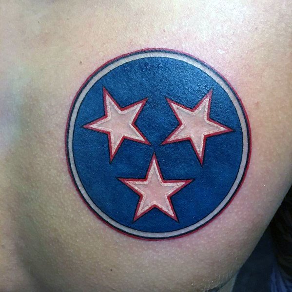 Bold Tennessee three-star emblem tattoo with a clean circular design, featuring a blue background and red-bordered stars for a striking look.