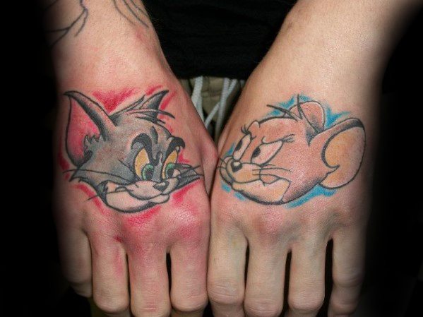 Matching hand tattoos of Tom and Jerry facing each other with red and blue highlights, inked in bold cartoon style.