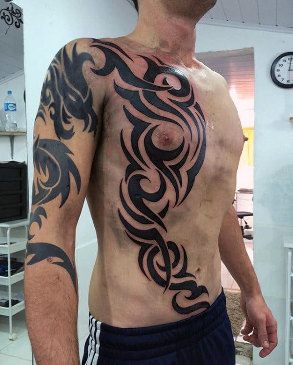 Creative Traditional Guys Tribal Rib Cage Side Tattoos