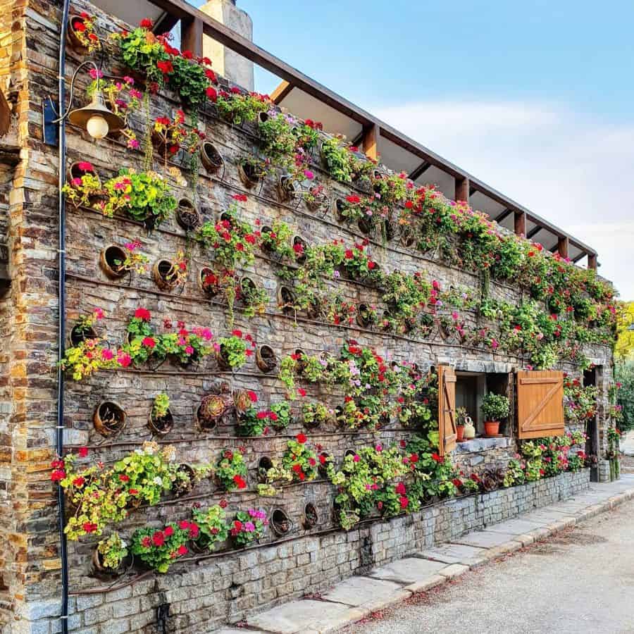 creative stone vertical garden flowers