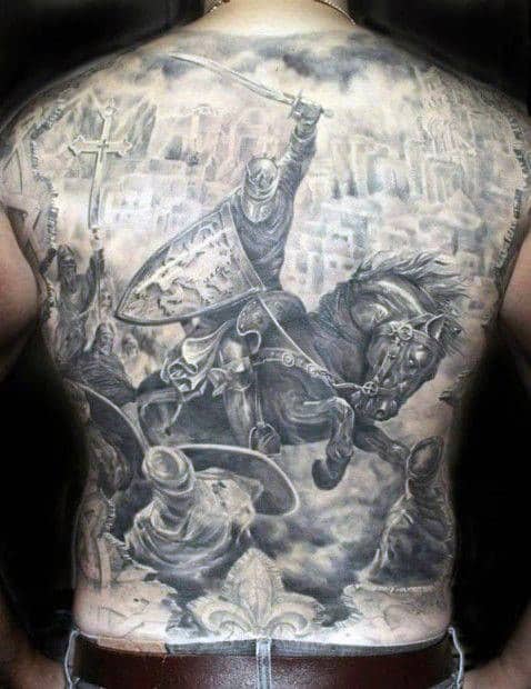 Detailed back tattoo of a medieval knight in battle on a horse, with a city background