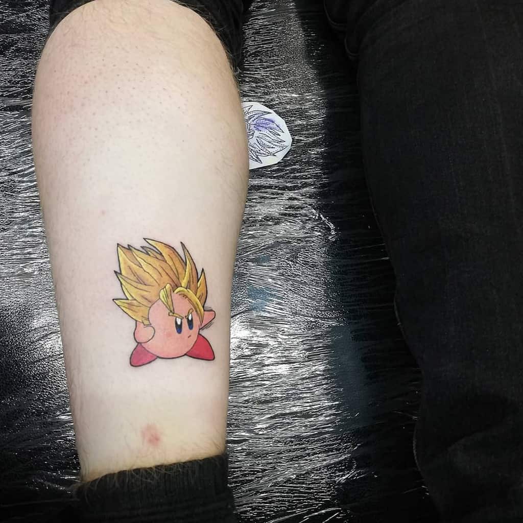 Kirby tattoo as a Super Saiyan, with spiky golden hair and a fierce expression