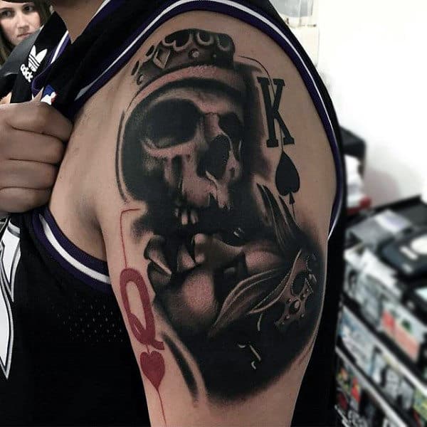 Crowned Skull With King And Queen Symbol Tattoo Upperarm