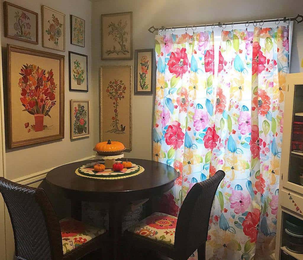 small corner table and chairs floral curtains framed floral wall art