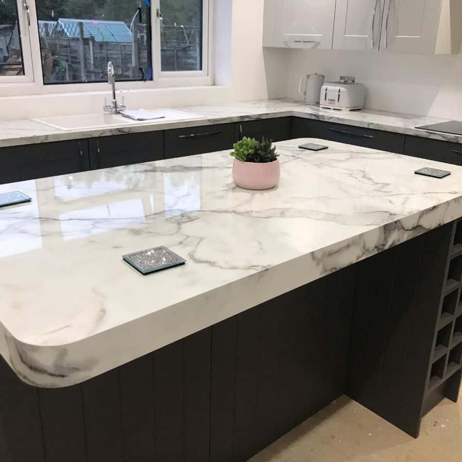 corner kitchen with marble countertop