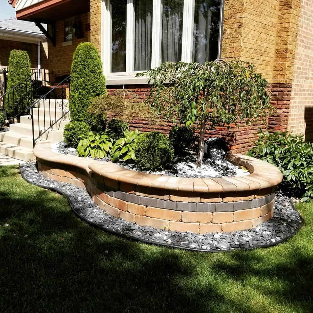 curved brick garden wall front yard grass lawn