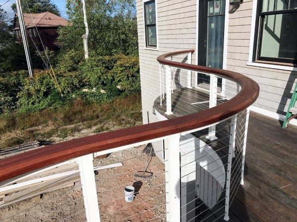 curved white and brown deck railing