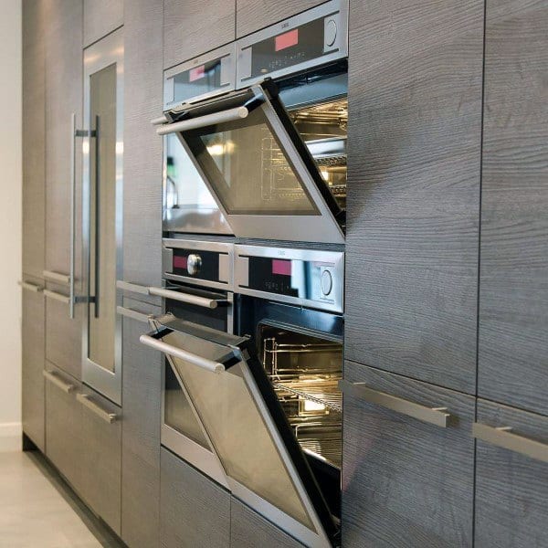 four ovens in wood cabinet kitchen 