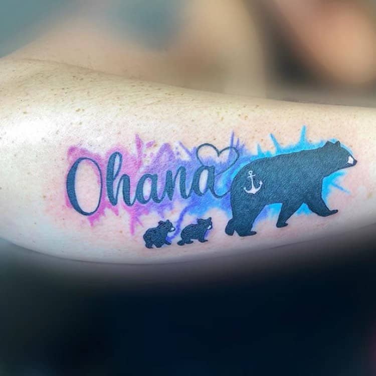 Watercolor tattoo of 'Ohana' with a bear and cubs, symbolizing family, protection, and love.