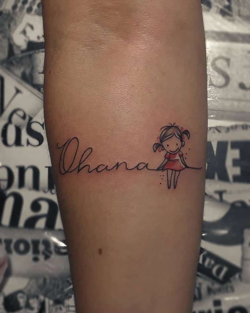 Sweet 'Ohana' tattoo with a little girl sitting on the script, symbolizing family, love, and childhood innocence.