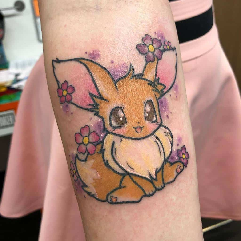 Sweet Eevee tattoo surrounded by colorful flowers and soft purple accents, showcasing a cheerful and vibrant design