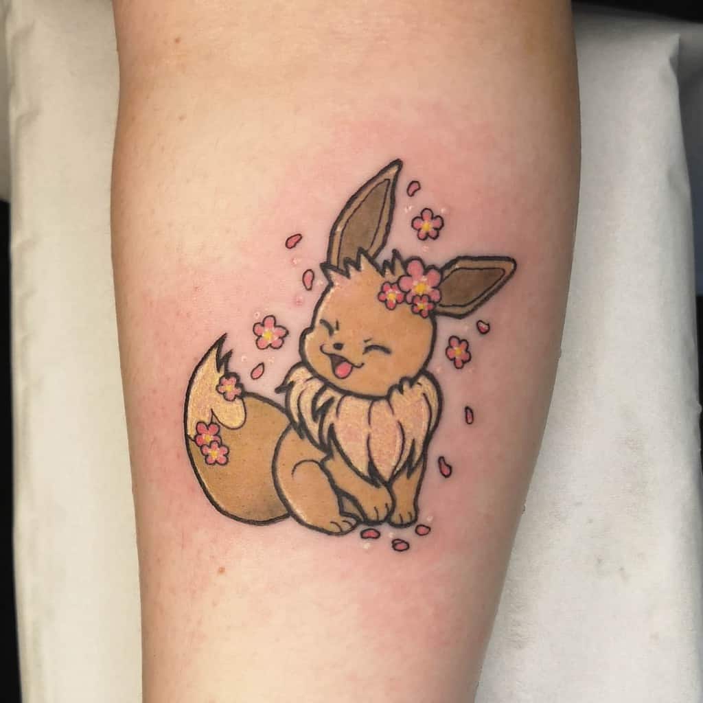 Cheerful Eevee tattoo surrounded by pink cherry blossoms, showcasing a playful and joyful vibe
