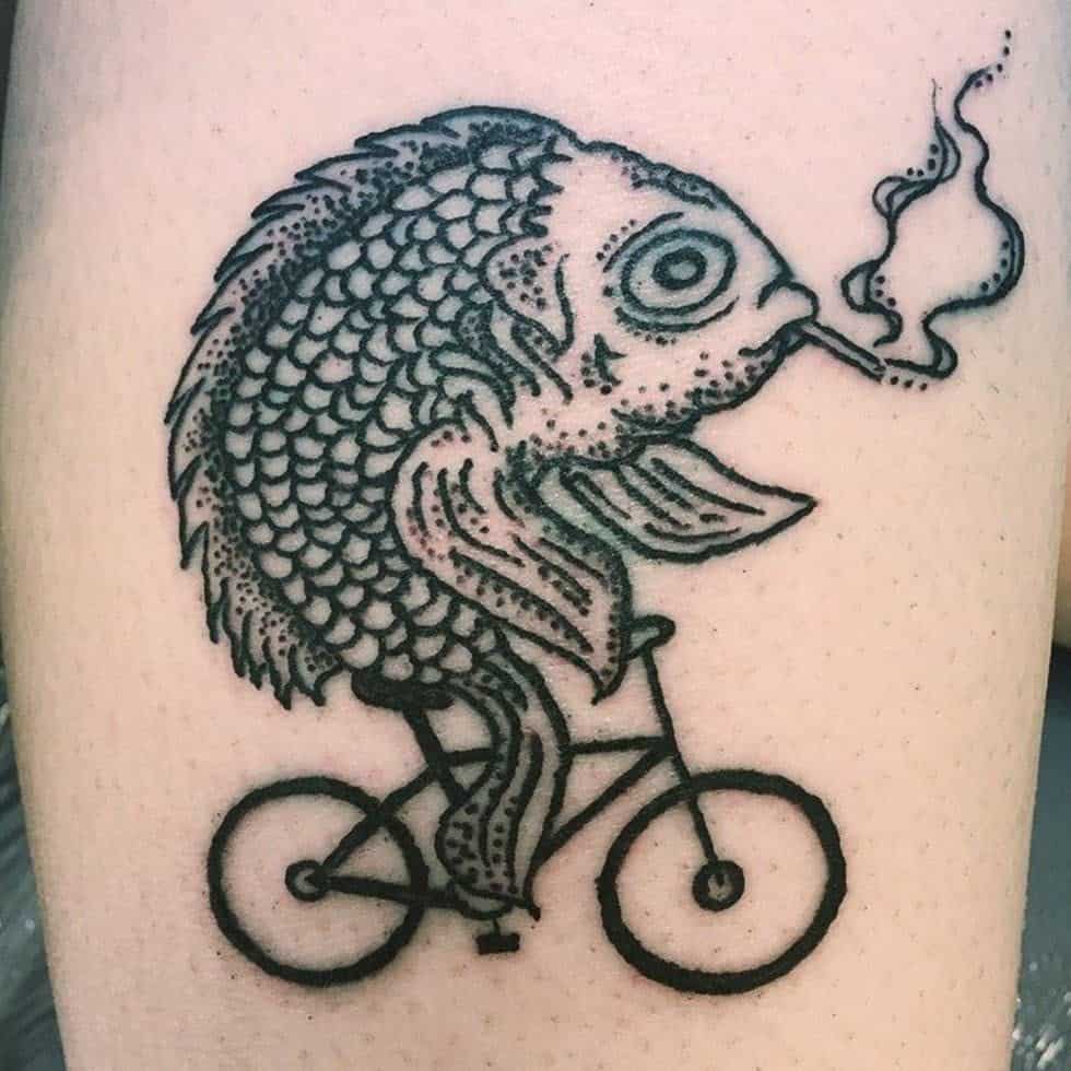 A black ink tattoo of a detailed fish riding a bicycle while smoking, blending surreal and humorous elements in a bold style.