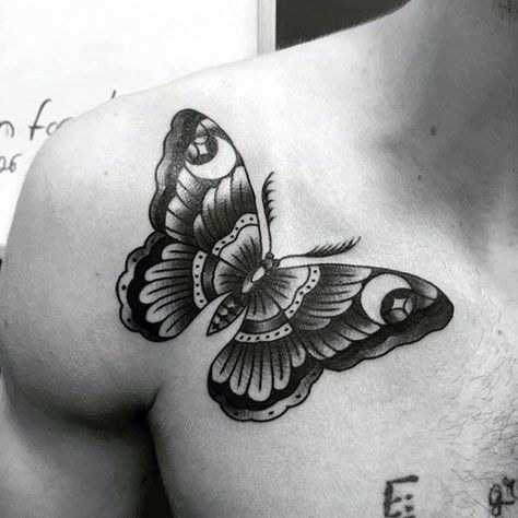Black and gray butterfly tattoo on the chest, featuring intricate shading, bold outlines, and fine details for a striking and artistic design.