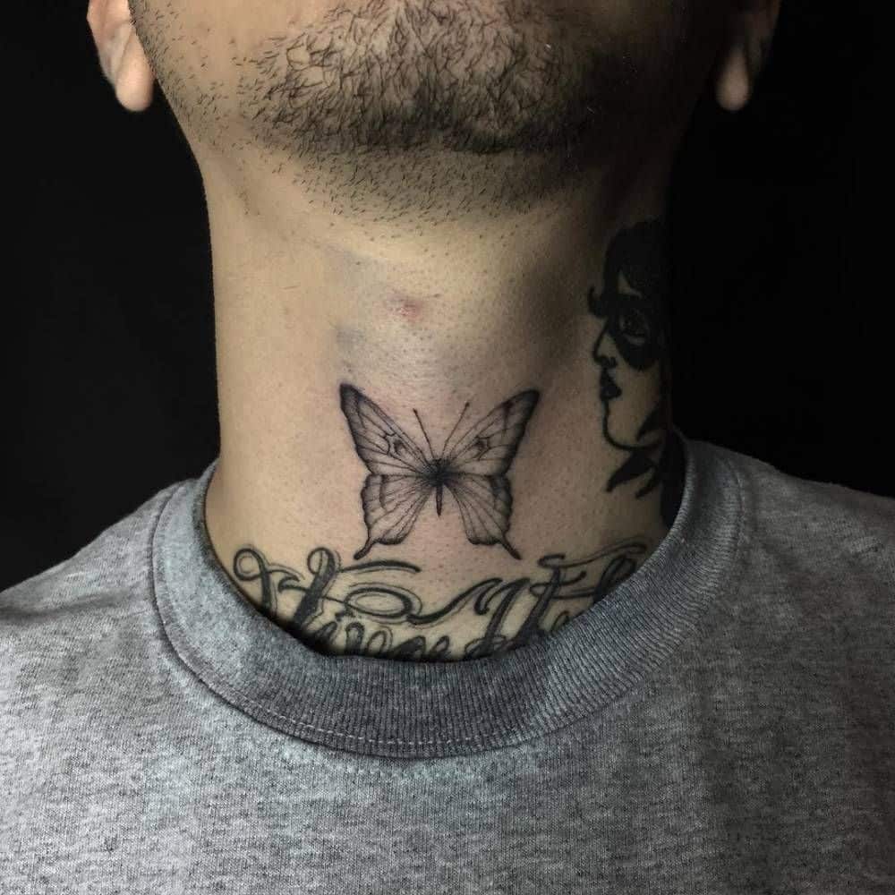 Delicate black and gray butterfly tattoo on the throat, featuring fine linework and subtle shading for a soft, detailed design.