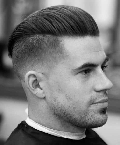 Dapper Male Undercut With Slicked Back Hair On Top