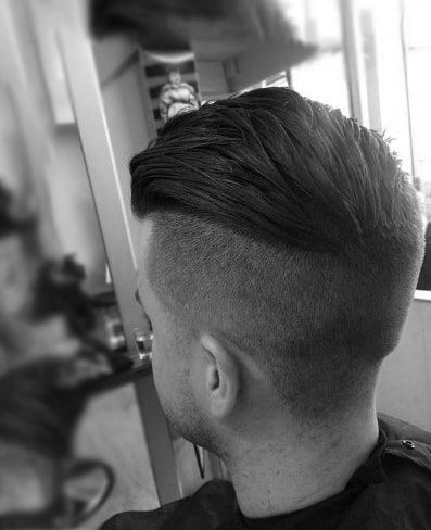Dapper Slicked Back Undercut Haircut For Males