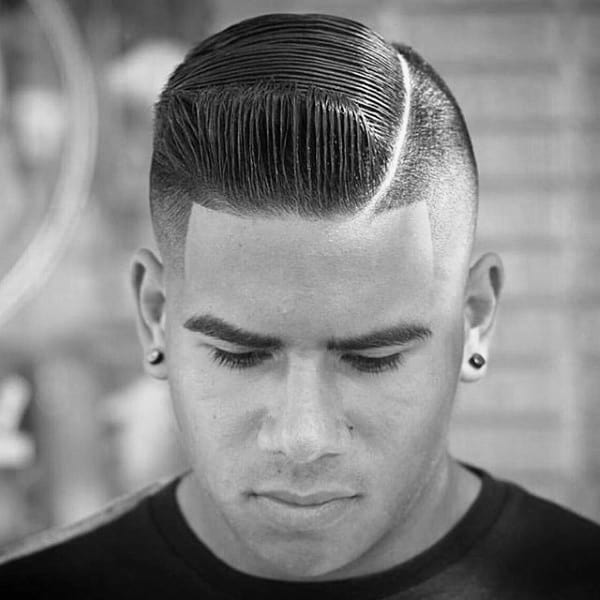 Dapper Slicked Comb Over Fade Haircuts For Males