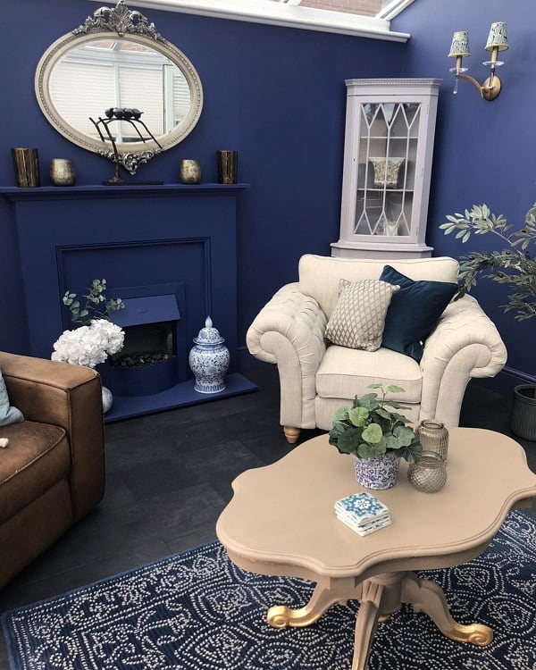 dark blue living room fireplace wall mirror corner cabinet single sofas