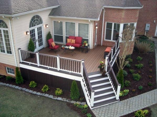country style dark brown composite deck skirting white accents