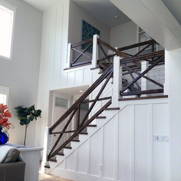 dark brown stained wood stair railing