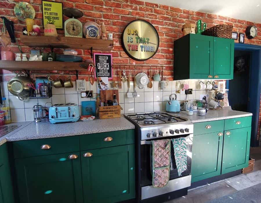 two tone brick wall white tile kitchen wall green cabinets