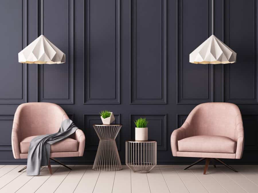dark gray accent wall living room pink chairs 
