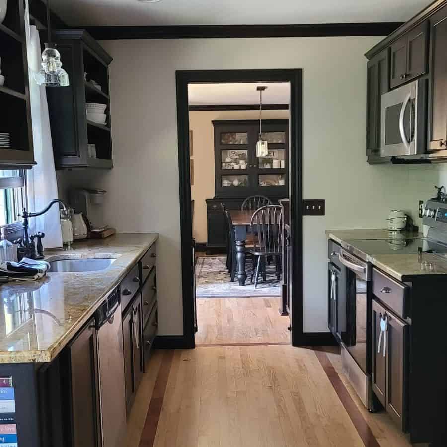 black galley kitchen wood flooring granite bench tops