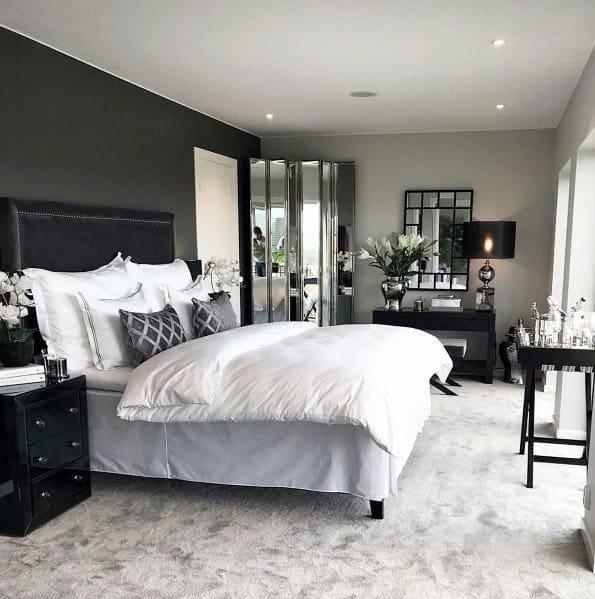 gray carpet master bedroom with black feature wall