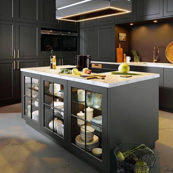 Dark grey kitchen with illuminated glass island cabinets and sleek modern design.