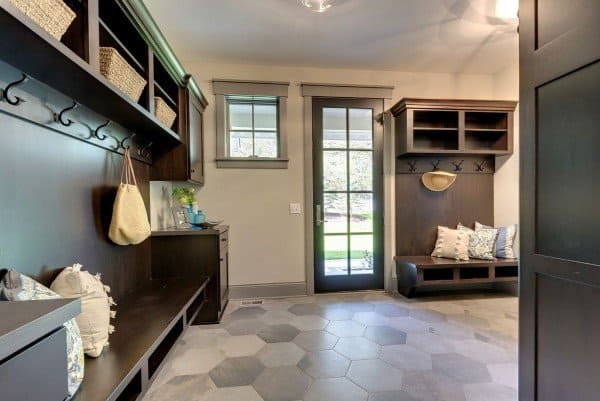 dark gray mudroom with cool hexagon flooring tiles