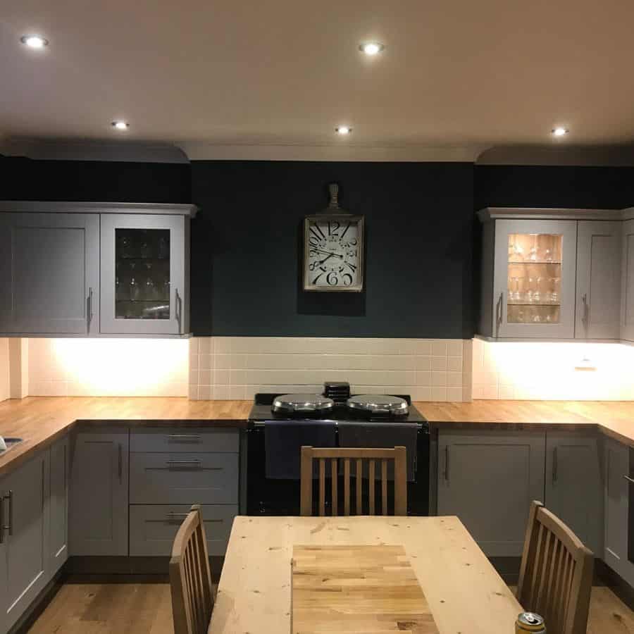 farmhouse kitchen white cabinets gray accent wall