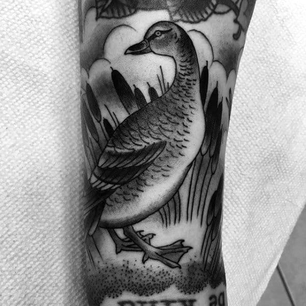 Dark Shaded Black Duck Tattoo On Guy