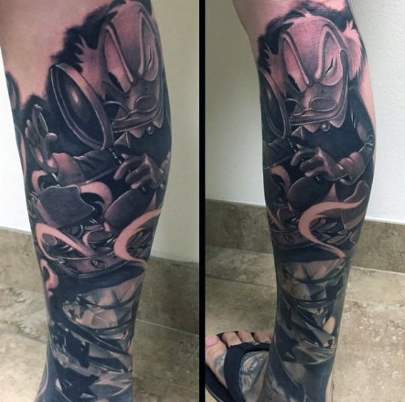 Dark Shaded Large Duck Cartoon With Magnifying Glass Leg Tattoo
