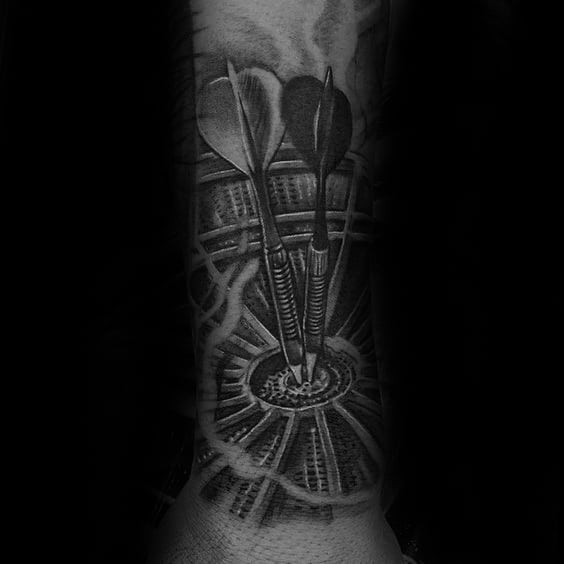Hyper-realistic tattoo of two darts hitting the bullseye with smoke-like shading, capturing focus, intensity, and pinpoint accuracy.