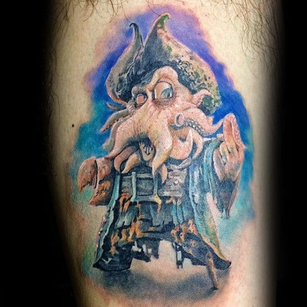 Tattoo of Davy Jones with a squid-like face and tricorn hat, set against a blue background