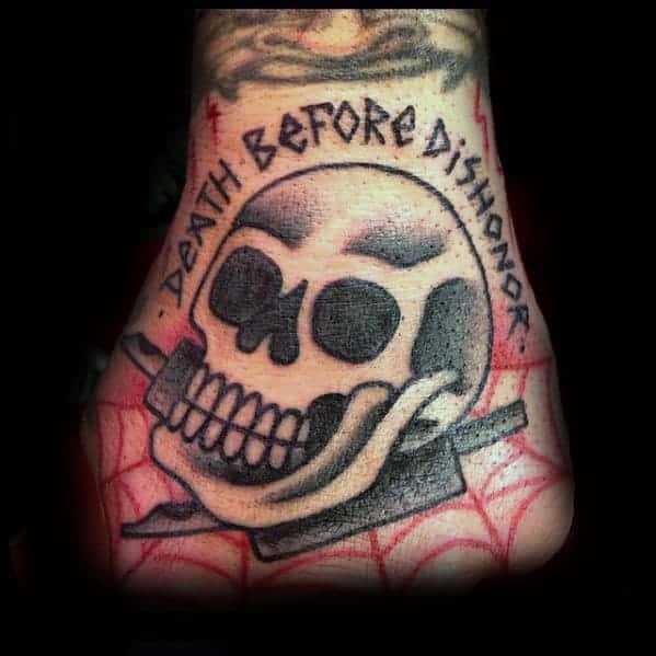 A skull tattoo with the text "Death Before Dishonor" above it