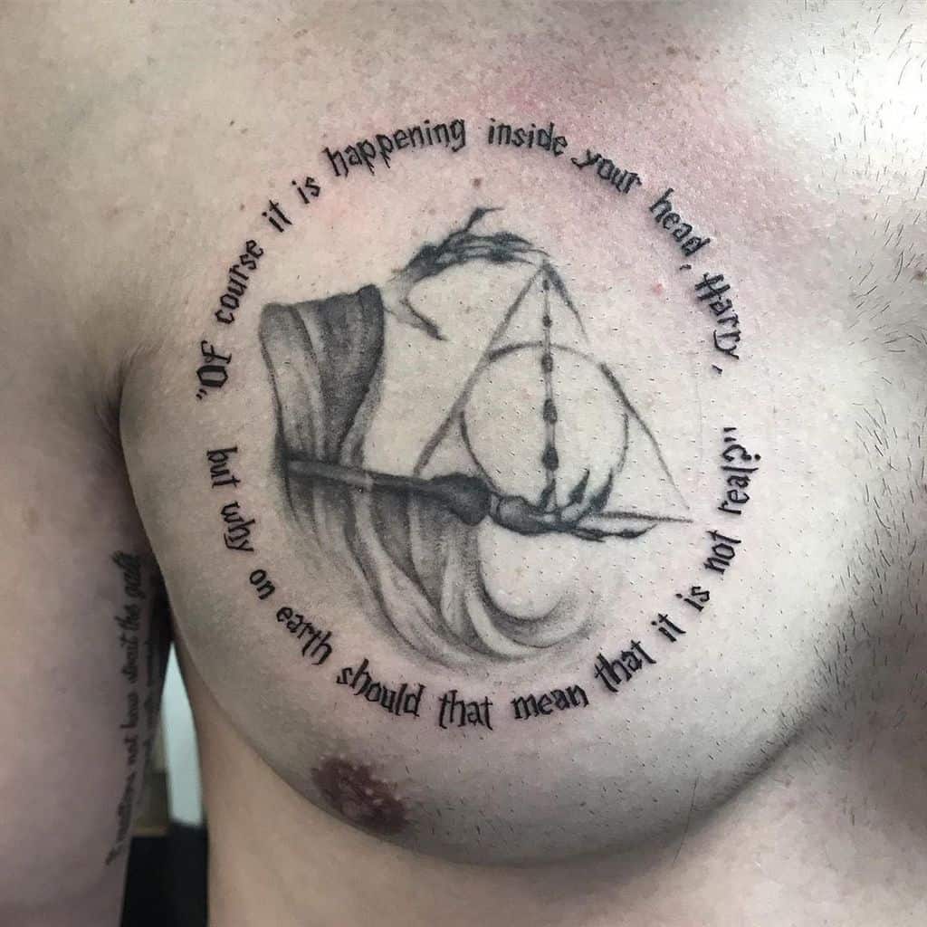 Deathly Hallows chest tattoo featuring a Dementor, Elder Wand, and the quote, 'Of course it is happening inside your head, Harry...'