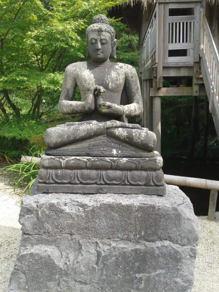 praying stone religious statue zen garden 