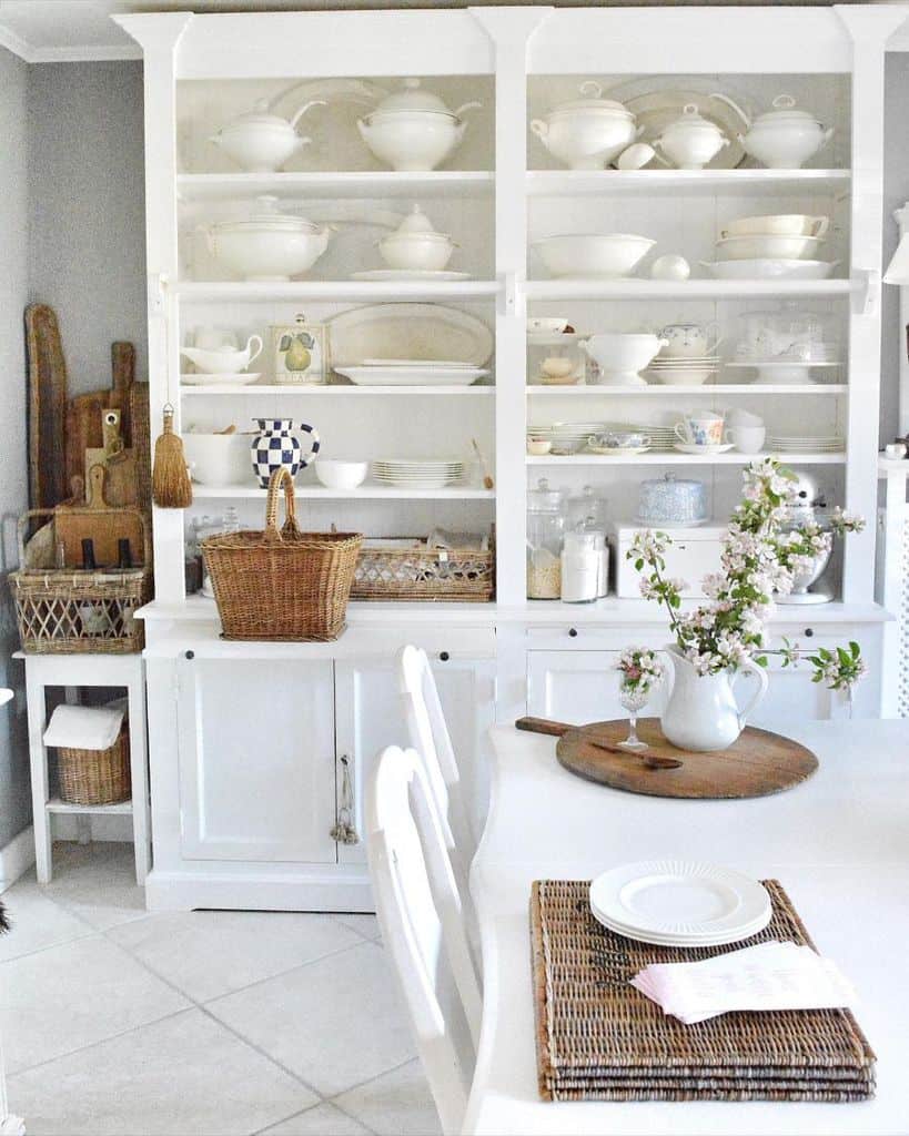 french country kitchen large white cabinet cutlery white table 