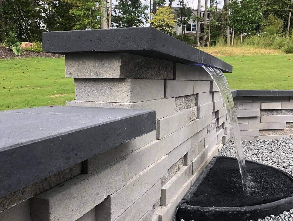 backyard stone paver wall water feature