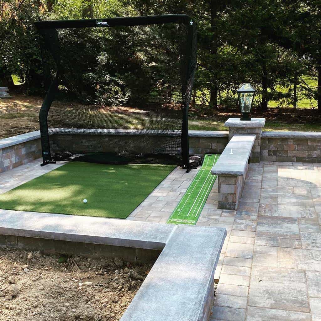 stone paver patio and wall homemade driving range