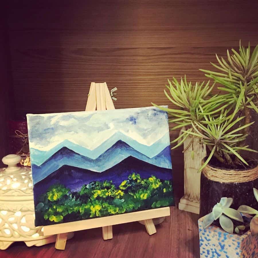 nature painting on easel cubicle office decor