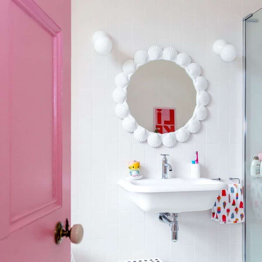 white tile bathroom floating sink pink door