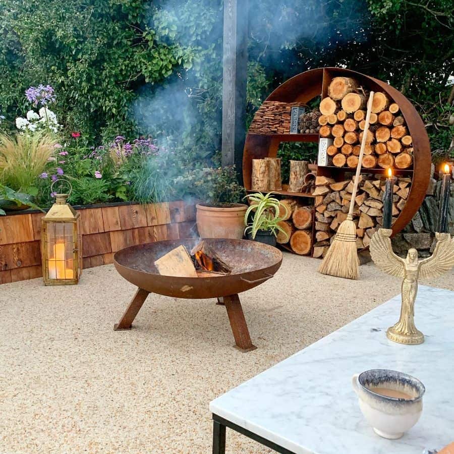 metal fire pit wood storage marble table broom