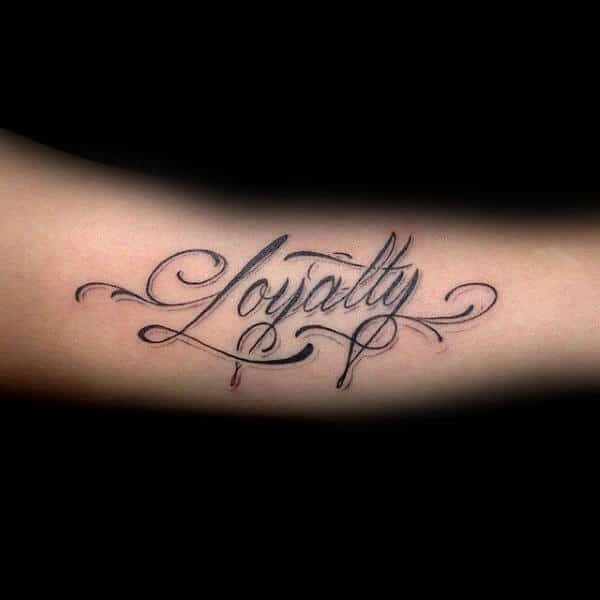 Decorative Male Tattoo Of Loyalty Word On Arm