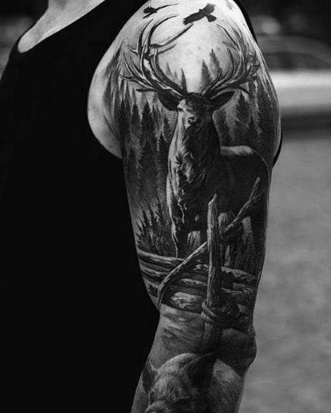 Realistic black and grey tattoo of a majestic stag in the forest, symbolizing strength, wilderness, and a deep connection to nature.